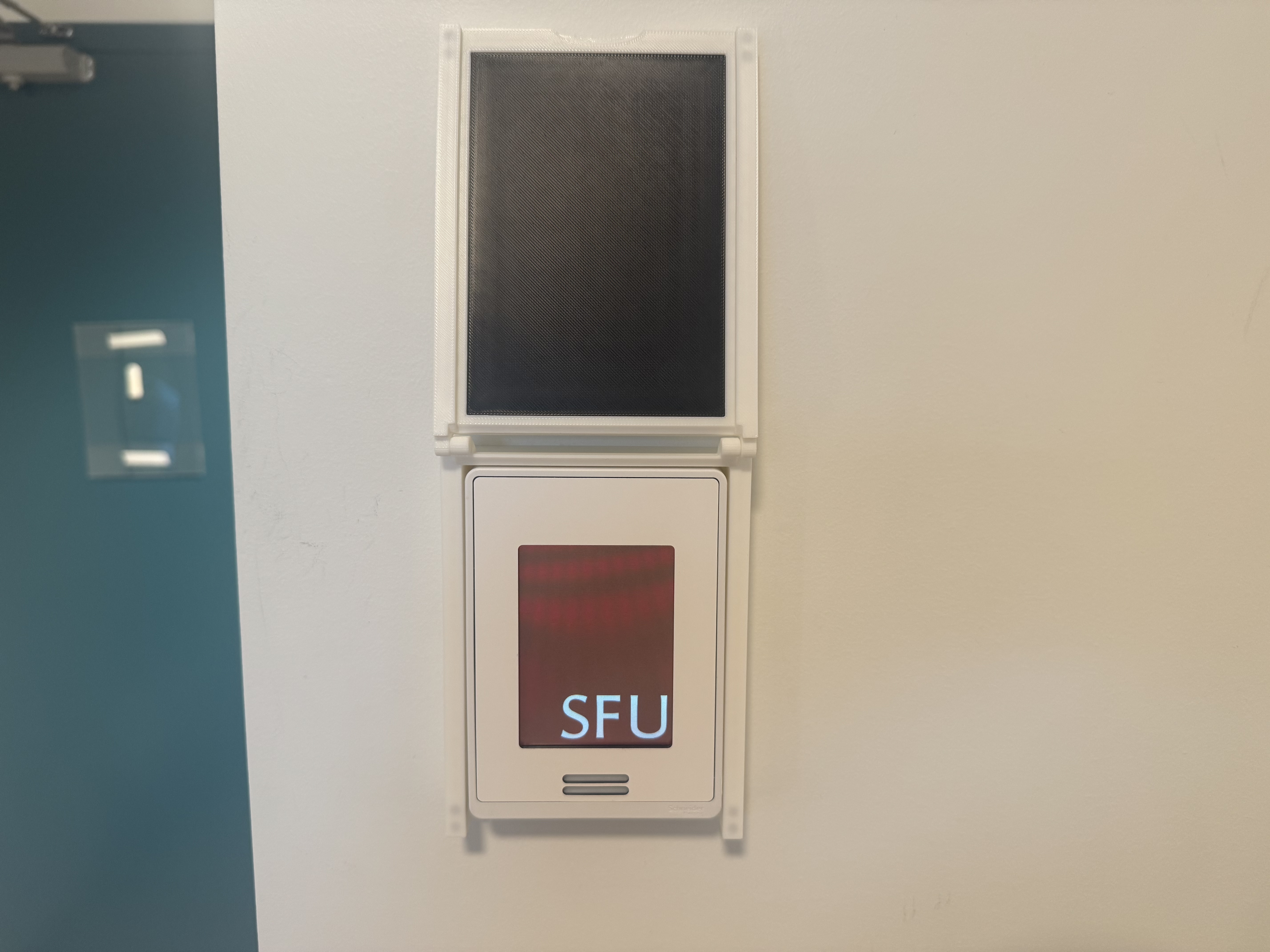 White 3D-printed thermostat cover hinged open above the thermostat